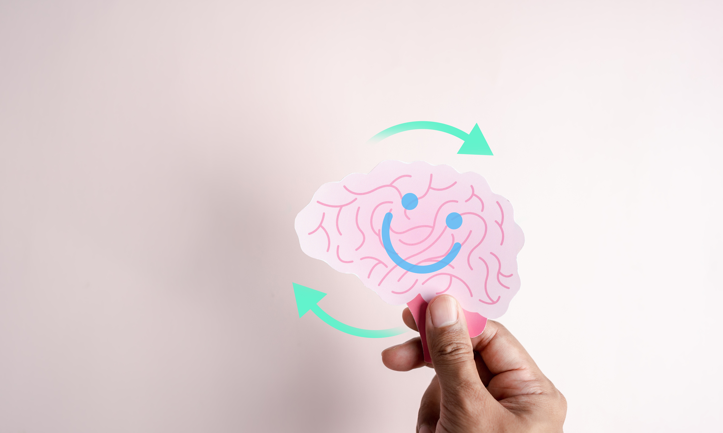 Hands holding blue happy smile face. mental health positive thinking and growth mindset, mental health care recovery to happiness emotion.